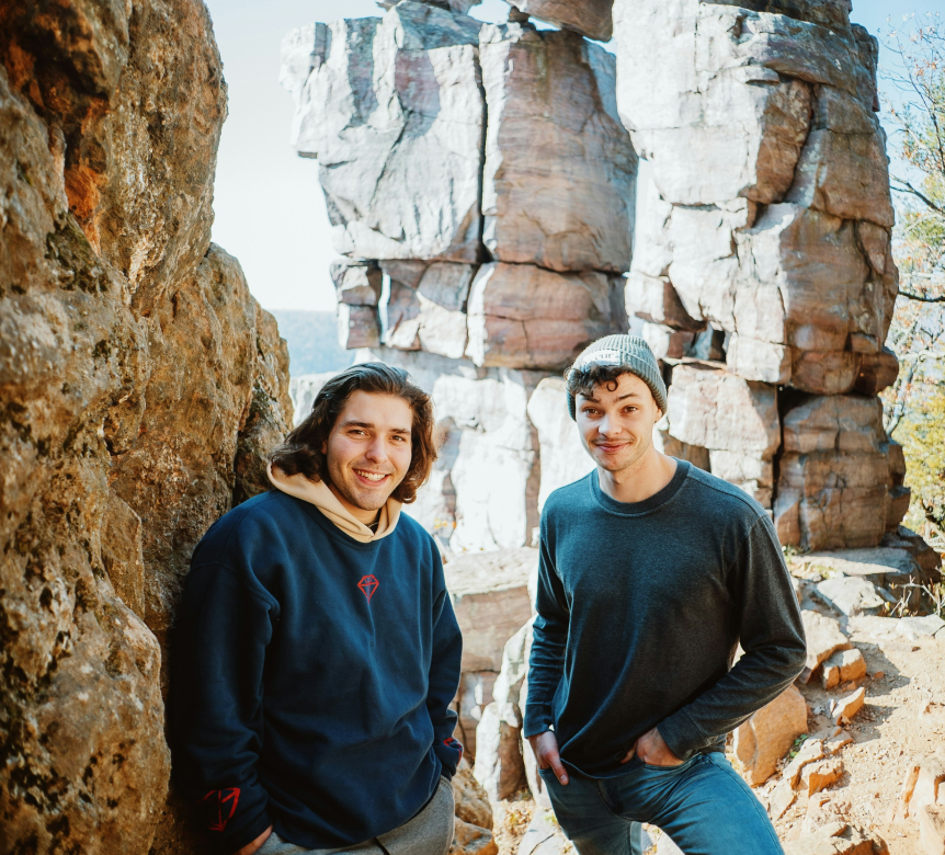 Fisher brothers near rocks